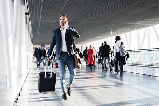 Corporate traveller in an airport catching a flight to an international conference